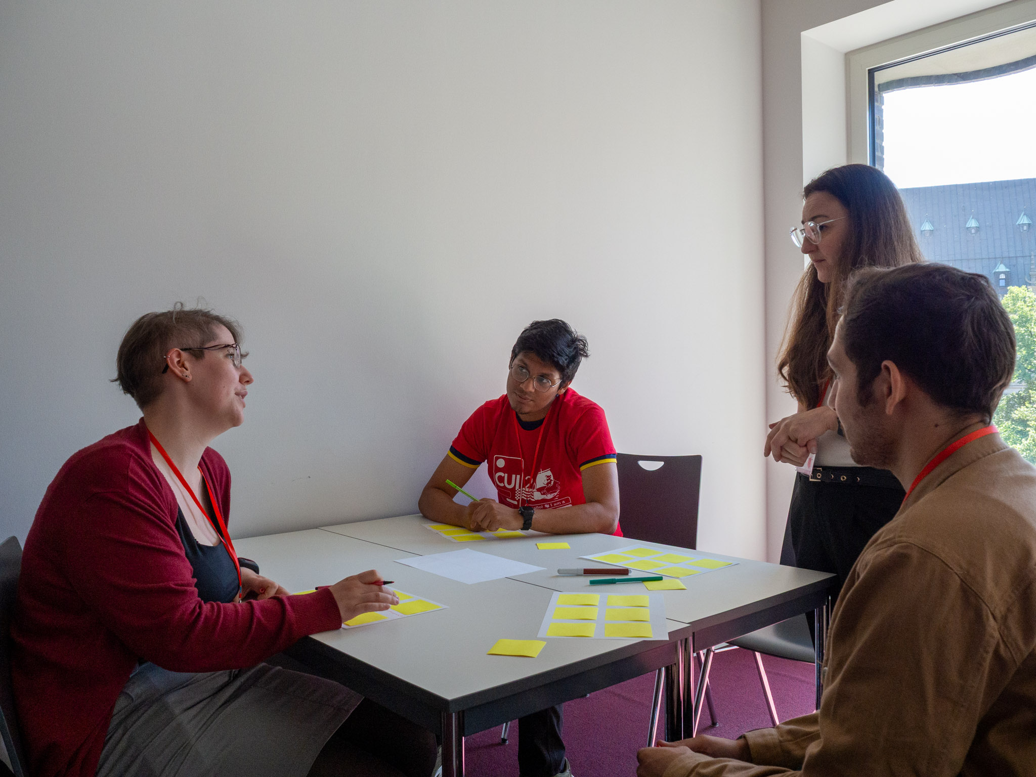Group 3 talking with one of the organizers